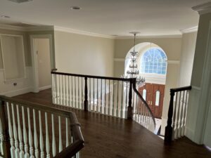 A view of wooden flooring and a staircase  